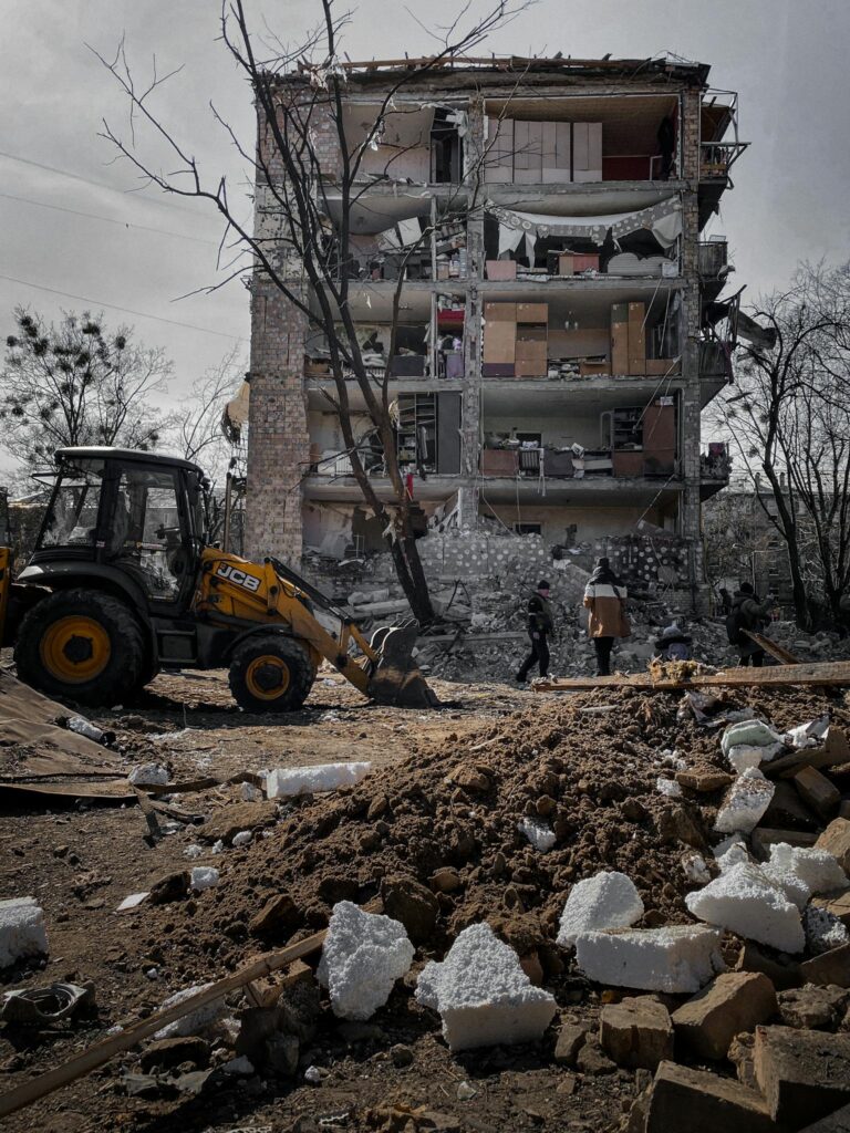 A destroyed building in Kyiv, Ukraine, showing urban devastation and reconstruction efforts.